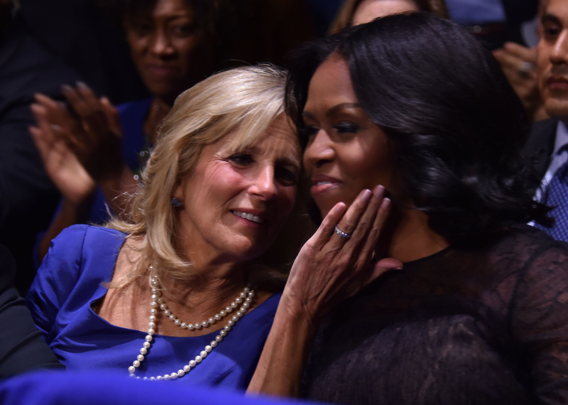 Jill Biden, wife of Vice President Joe Biden, and first lady Michelle Obama hug as President Barack Obama speaks during his farewell address in Chicago on Jan. 10, 2017. NICHOLAS KAMM/AFP/Getty Images